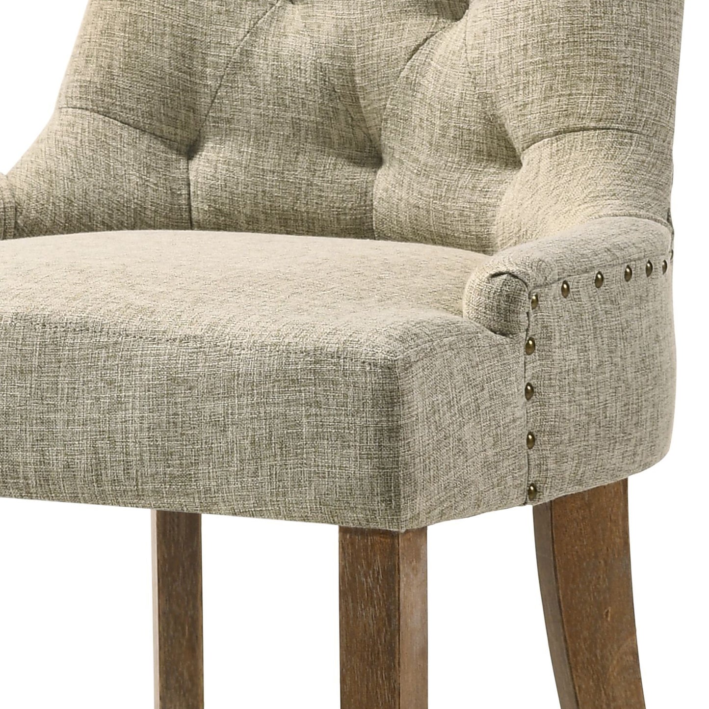 Tufted linen bar stool with brass nailhead trim and wooden legs