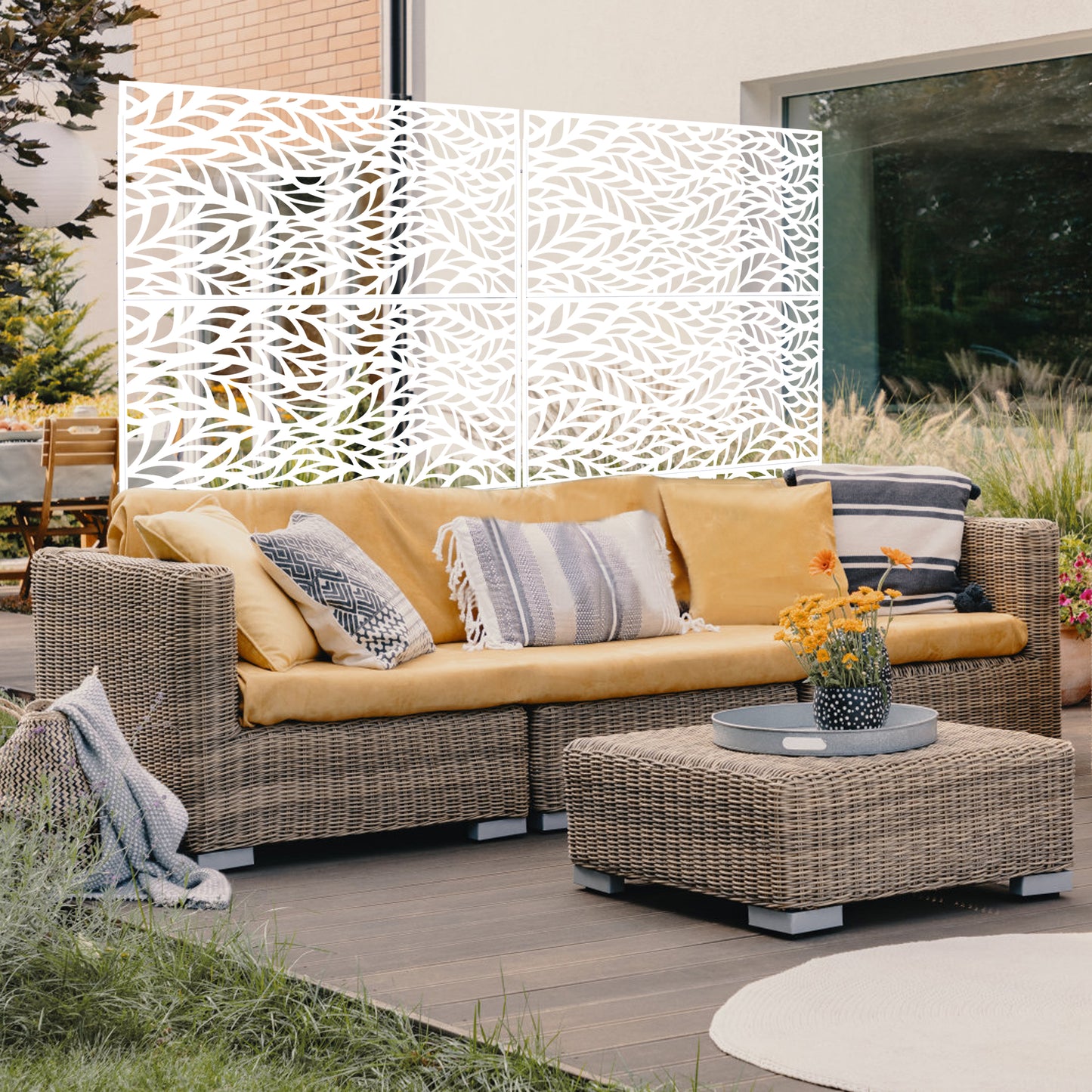 White decorative garden screen with intricate leaf pattern ideal for outdoor privacy