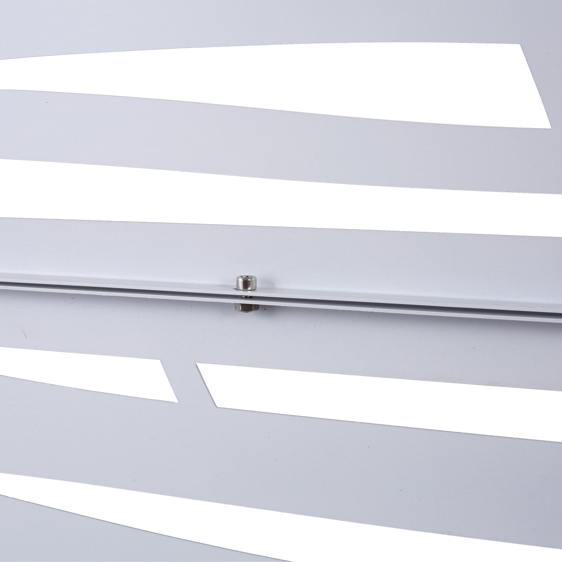 Modern white metal decorative panel with abstract cutouts and a visible screw