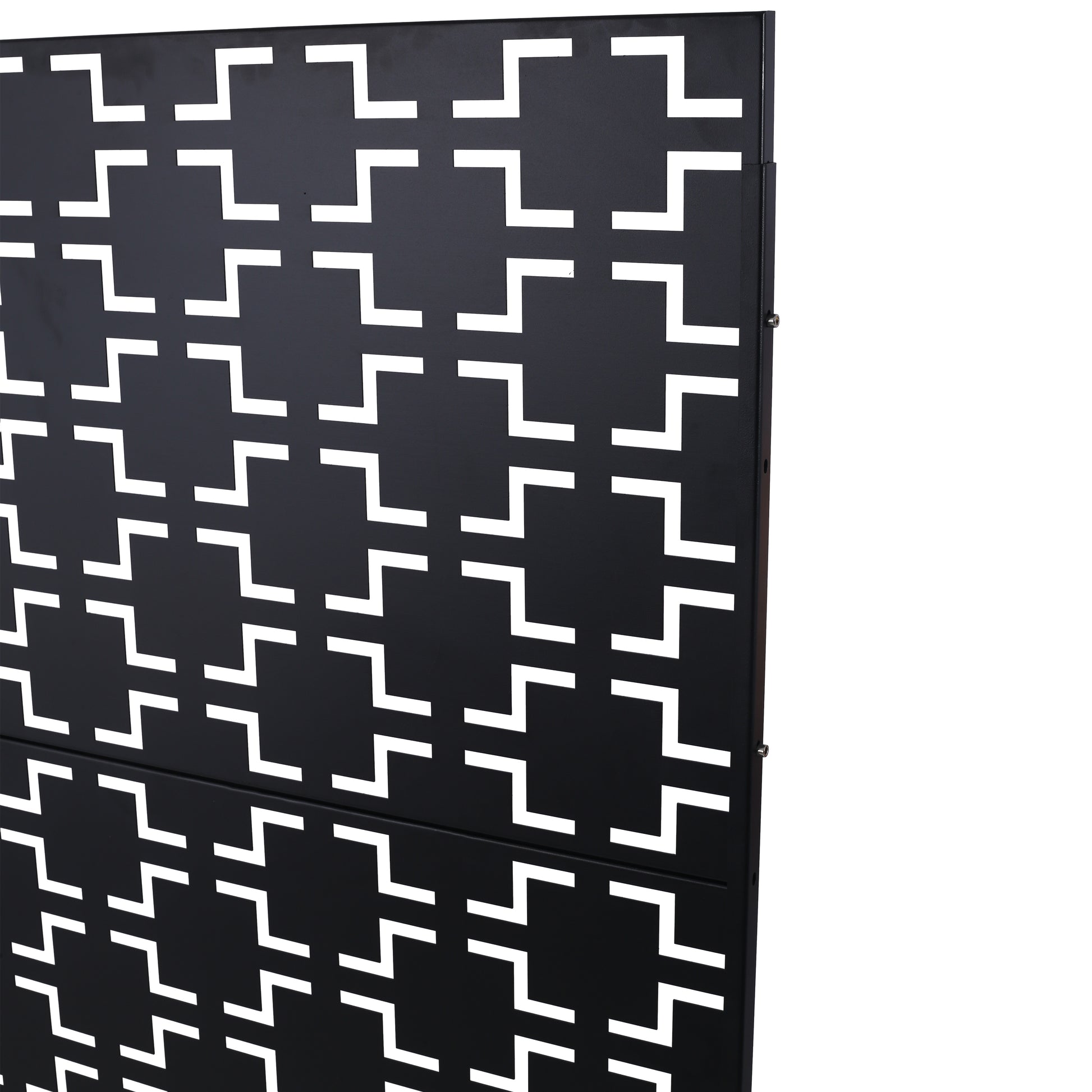 Black metal privacy screen with an interlocking geometric pattern for outdoor patios