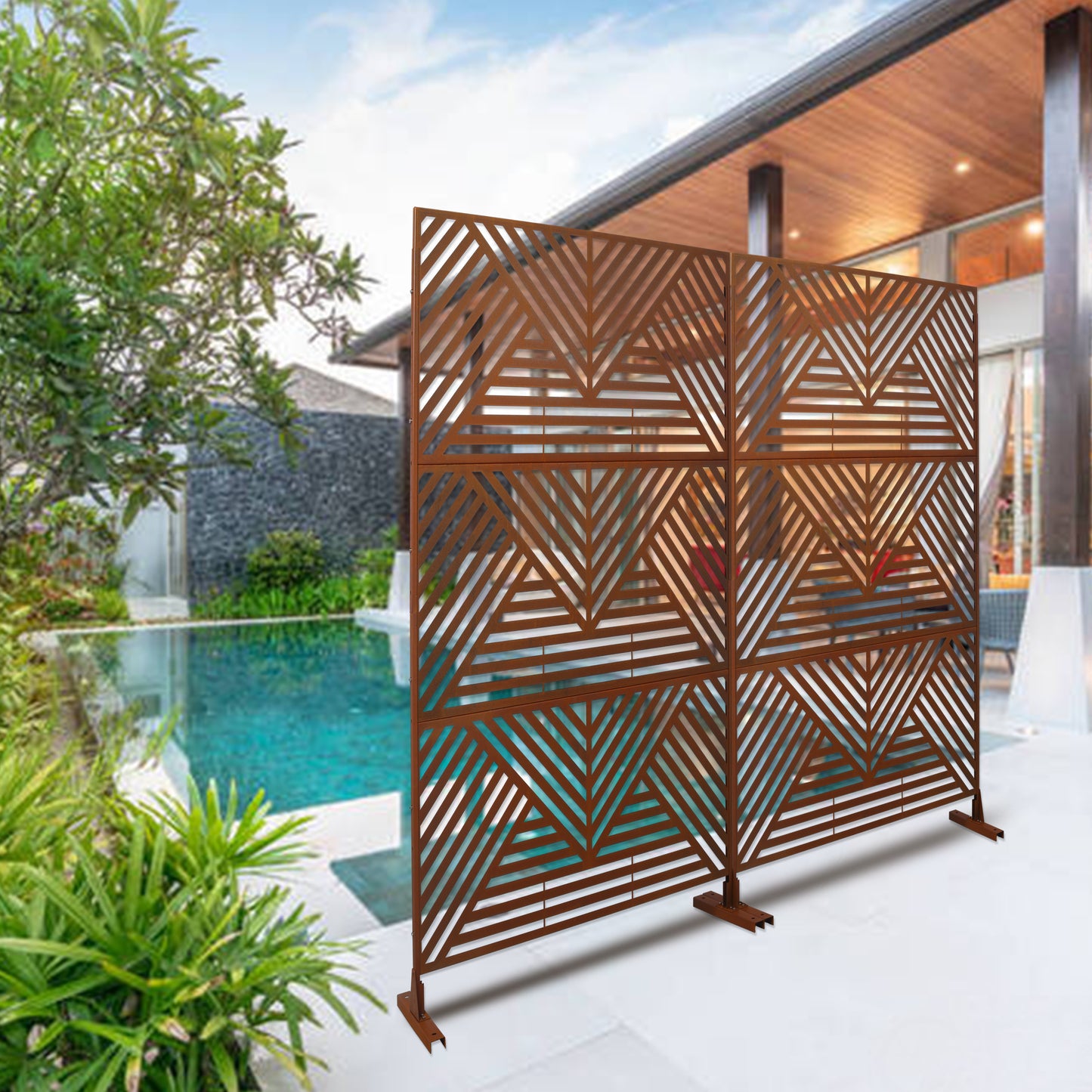 Rustic metal garden screen with geometric pattern providing privacy by the pool