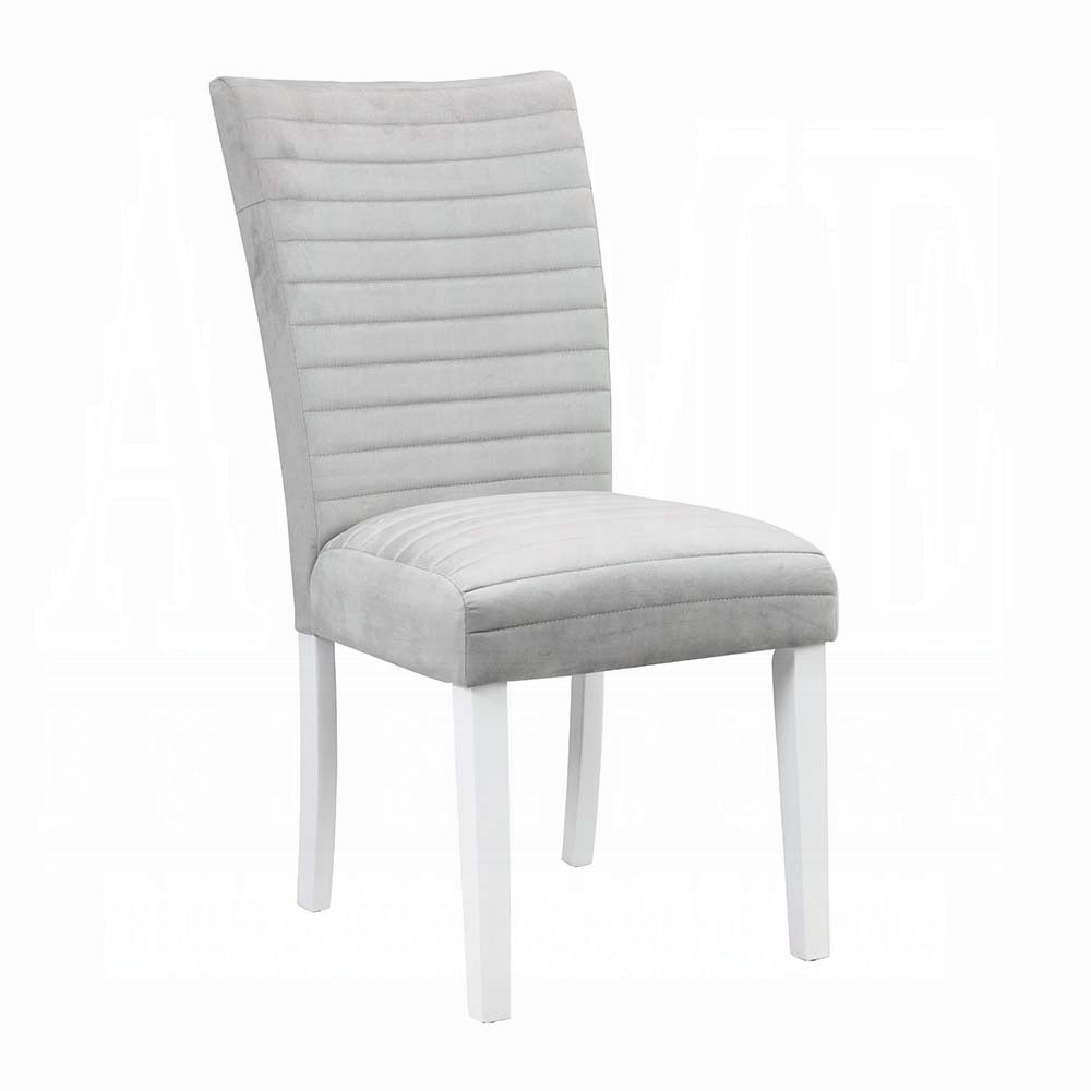 Light gray upholstered dining chair with horizontal stitching and white wooden legs