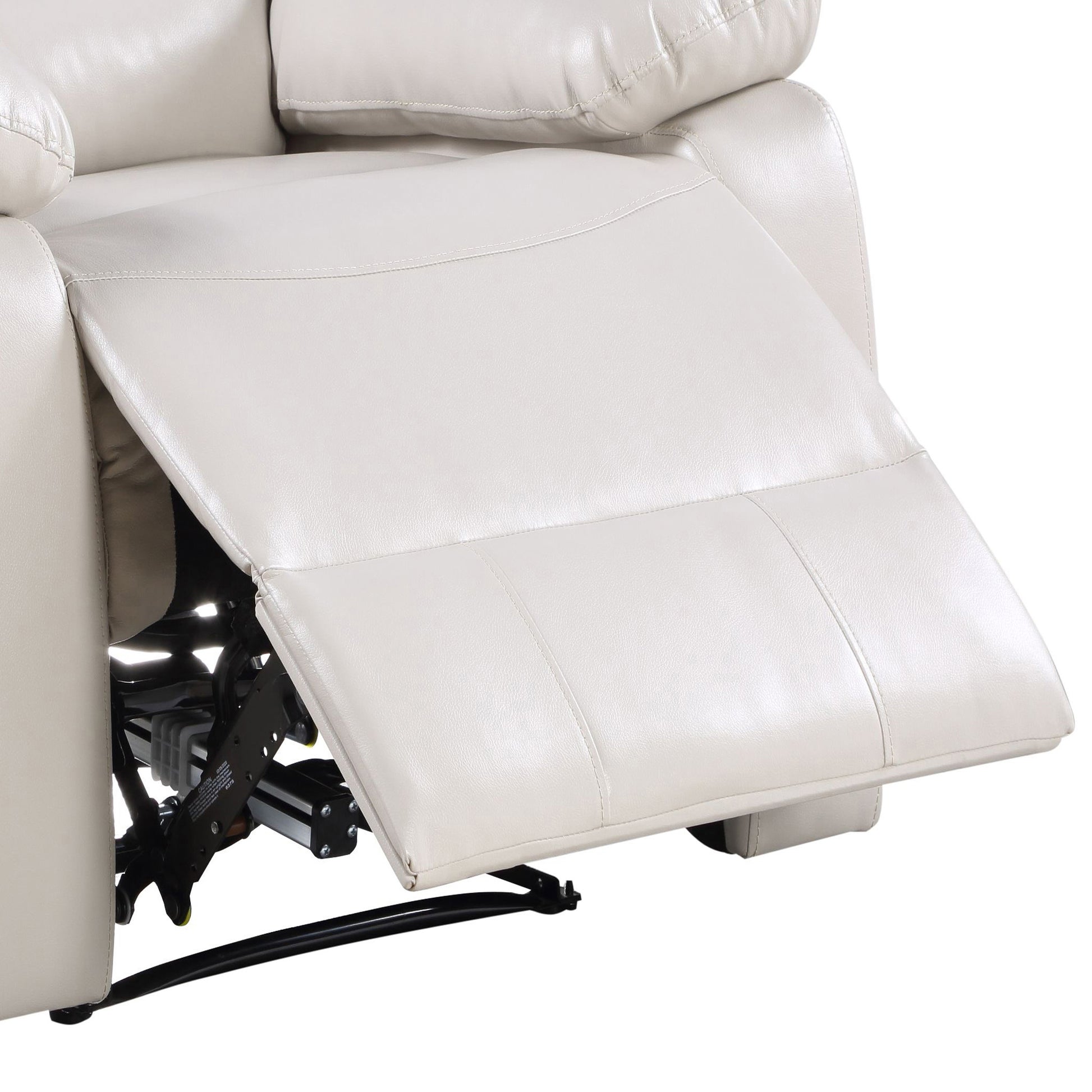 Cream leather recliner footrest extended showing mechanism and stitching