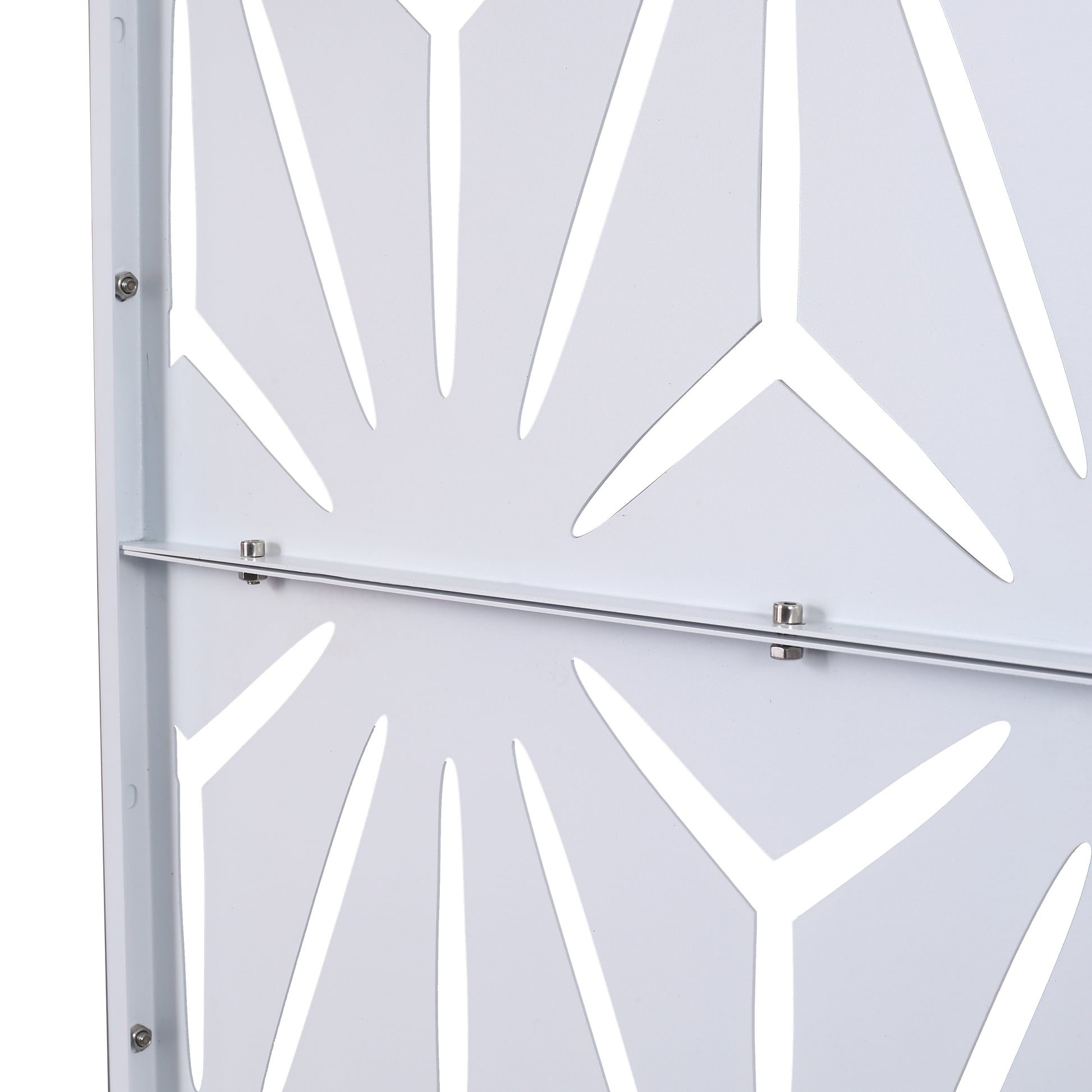 Closeup of a white decorative metal screen with a geometric pattern