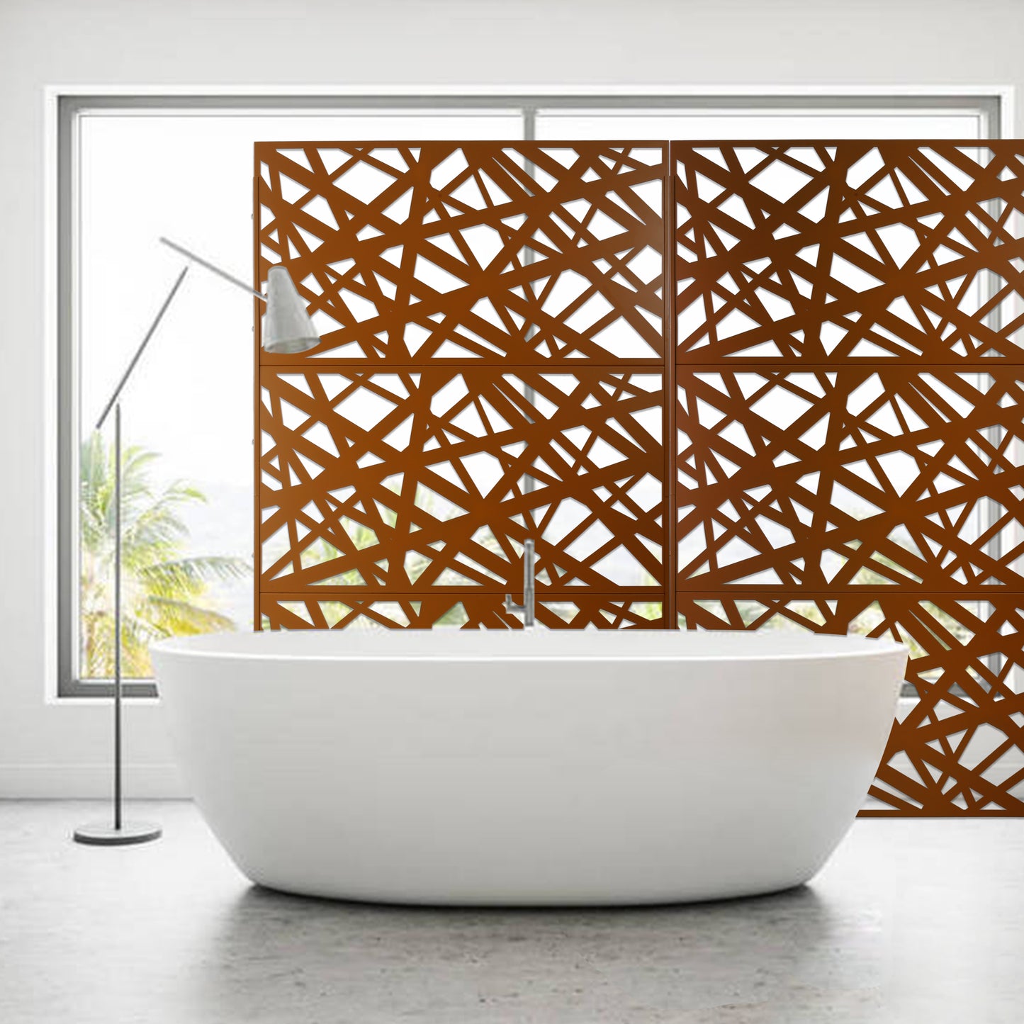 Modern freestanding white bathtub with abstract bronze room divider