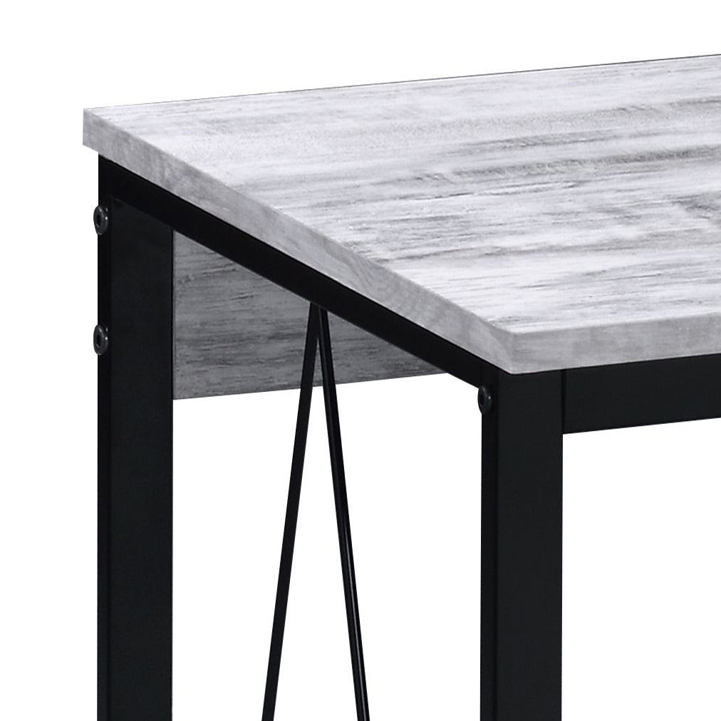 Closeup of distressed gray wood tabletop with black metal frame perfect for a rustic dining table