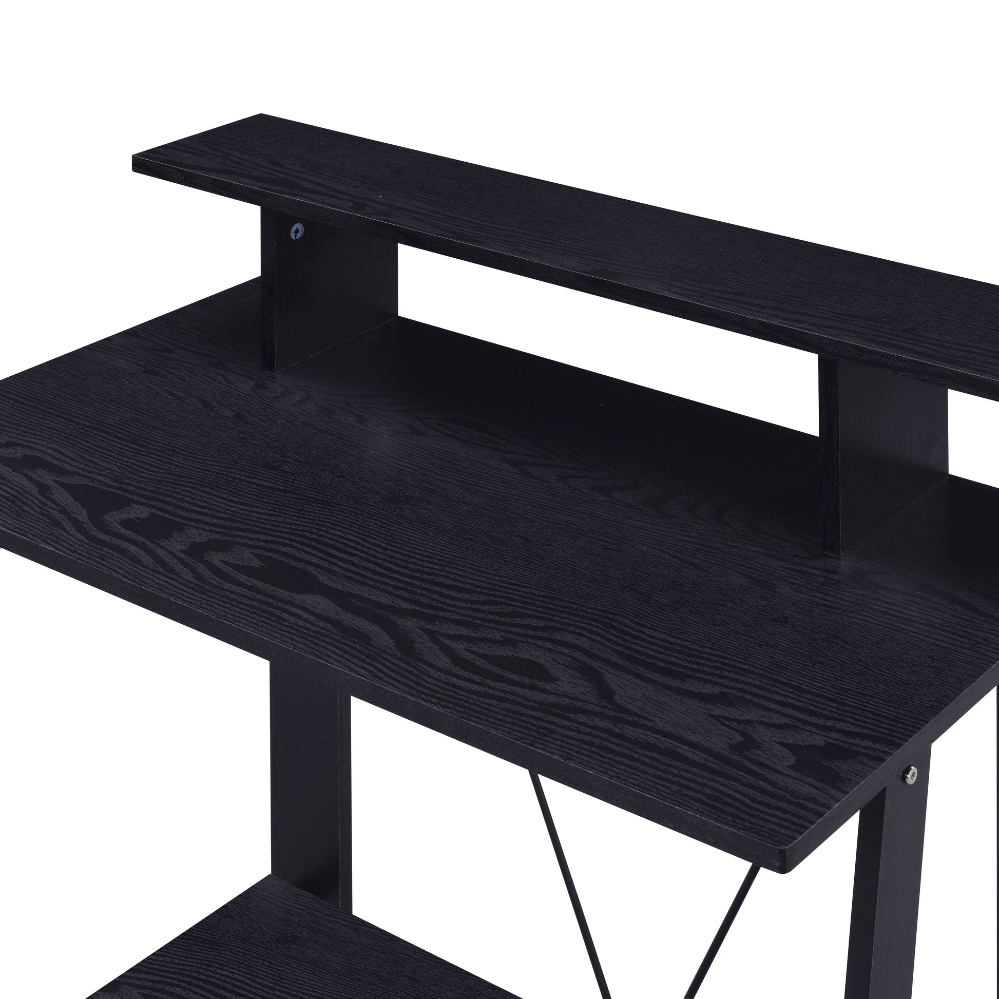 Black wood grain particleboard gaming desk with raised monitor shelf and open storage