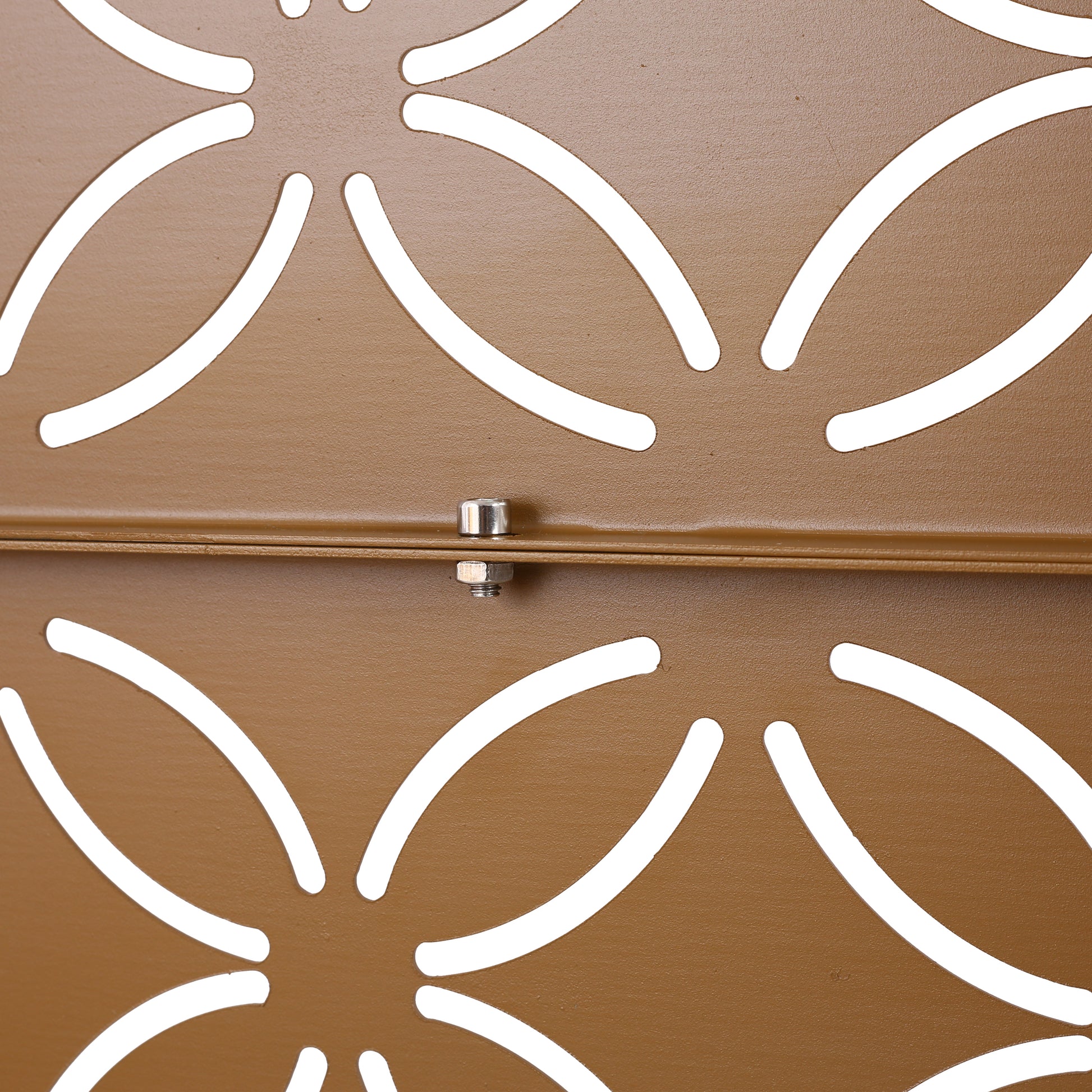 Brown metal garden planter with an ornate floral cutout design pattern