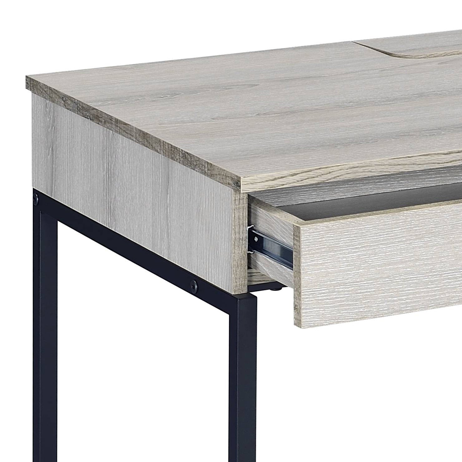 Rustic grey wood grain desk with a black metal frame one drawer open