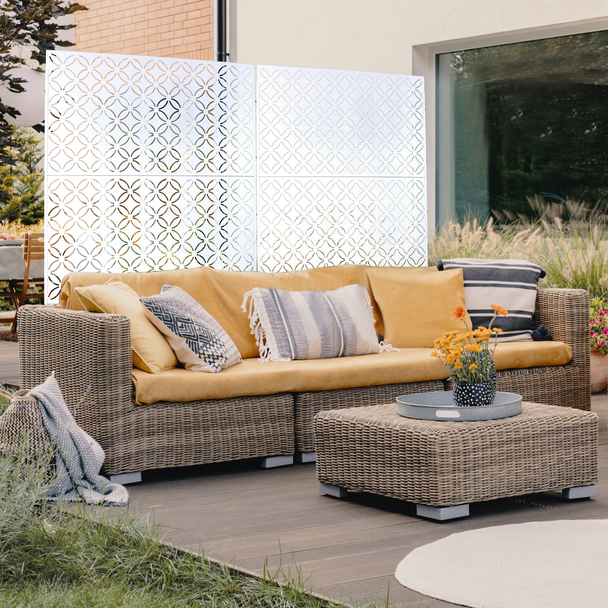 White decorative garden screen with a geometric circular pattern perfect for patio privacy