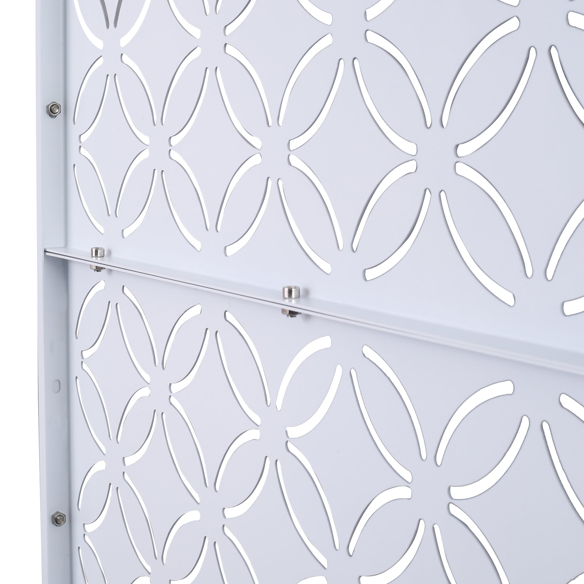 White perforated metal panel with a floral cutout pattern