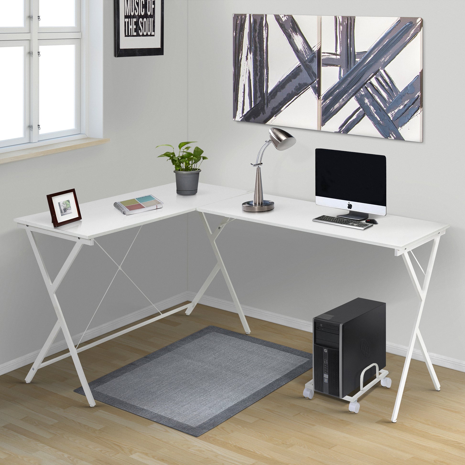 White modern Lshaped desk with computer lamp and plant for home office