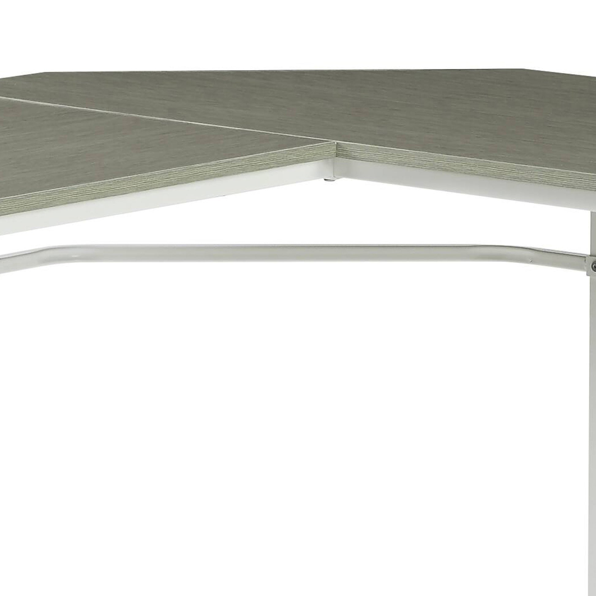 Closeup of a modern grey wood laminate corner desk with white metal legs and frame