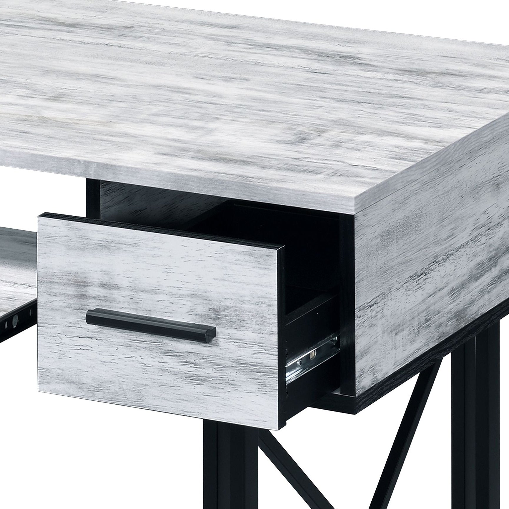 Whitewashed wood grain desk with black metal drawer pull and open drawer