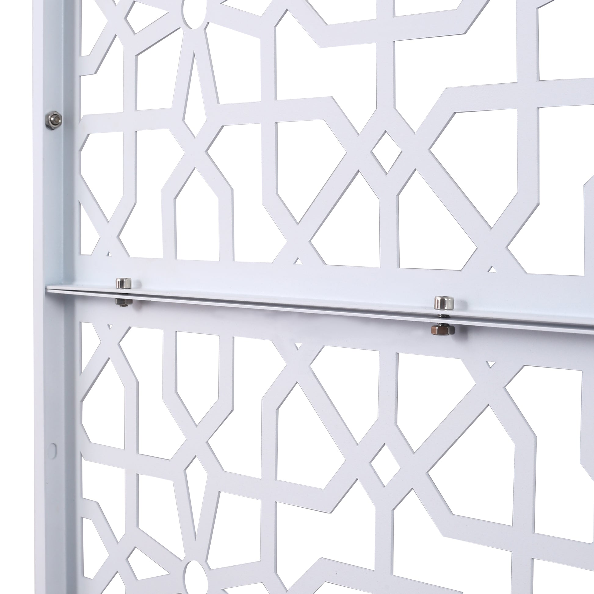 Closeup of white metal decorative screen panel with geometric star pattern
