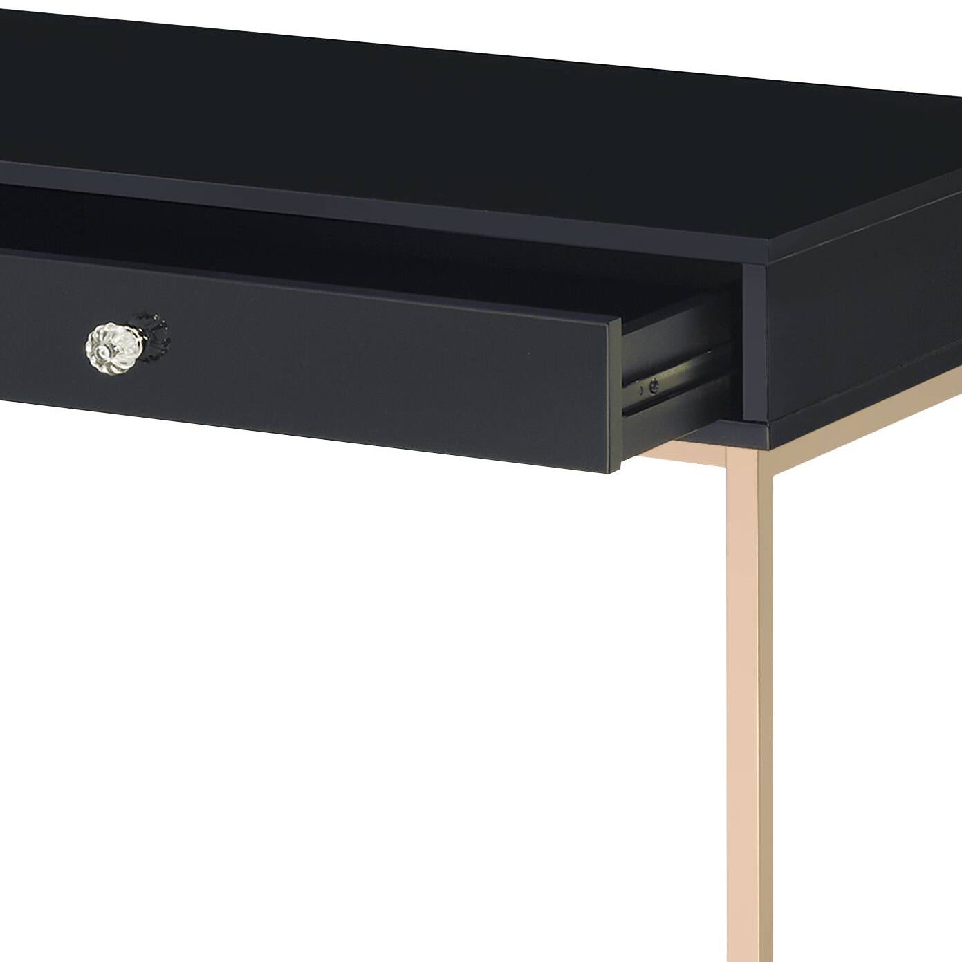 Sleek black vanity desk with a crystal knob and gold legs perfect for makeup storage