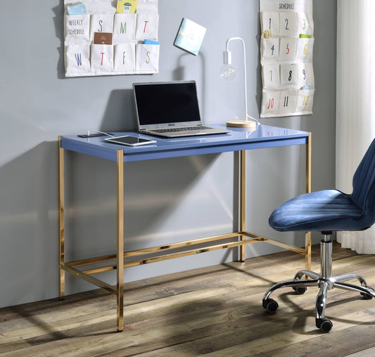 Blue executive desk with gold legs and a laptop and tablet setup
