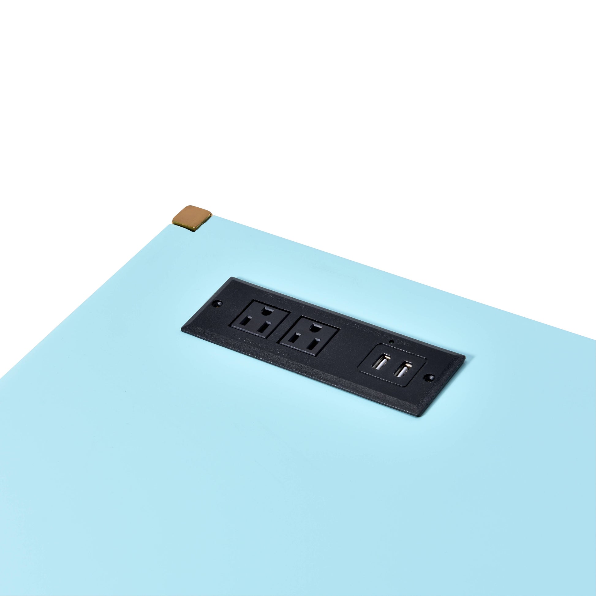 Black flushmount power outlet with dual USB ports on light blue surface