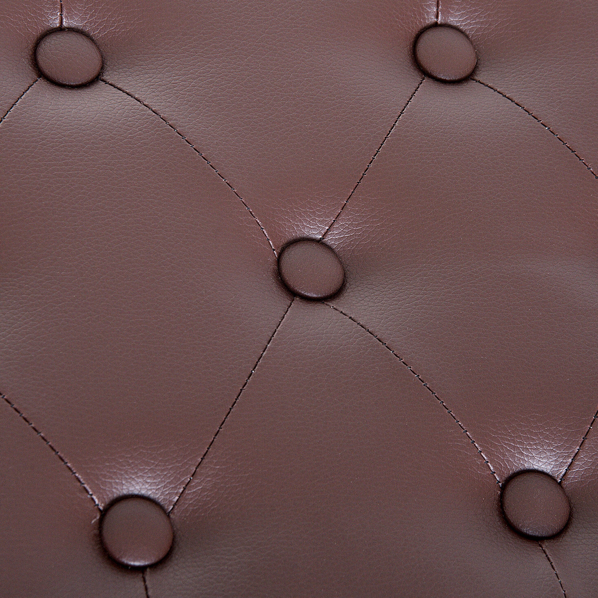 Brown faux leather tufted upholstery with diamond stitching