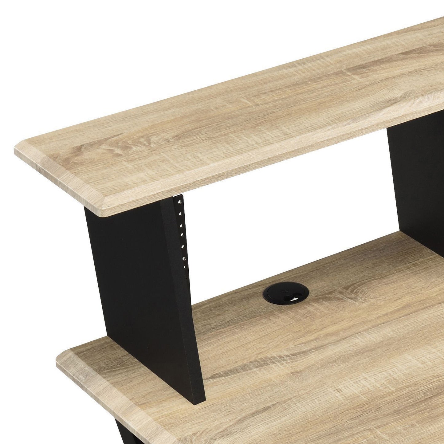 Wooden studio desk with black metal accents and a cable management grommet