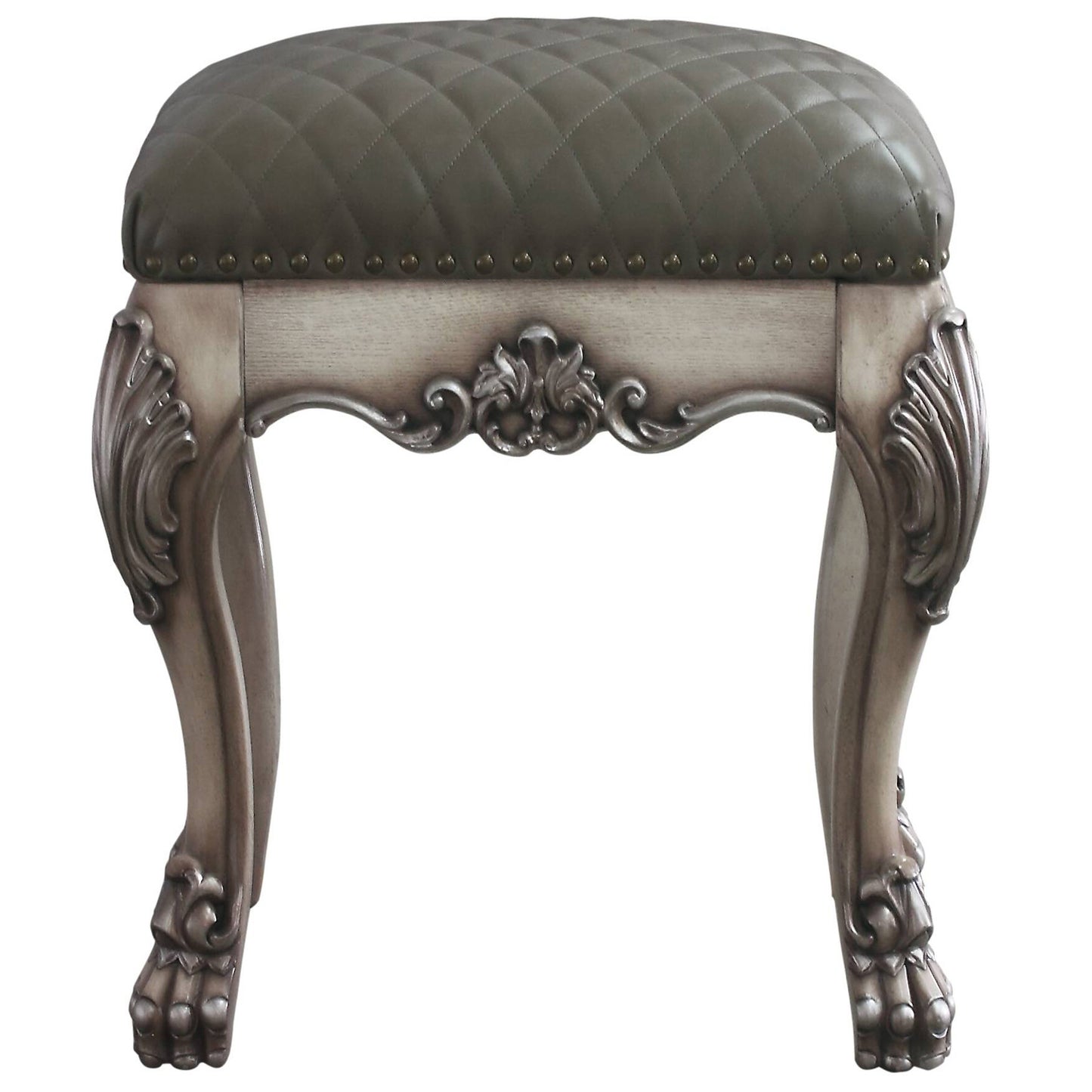 Grey tufted leather vanity stool with carved wooden legs and ornate detailing
