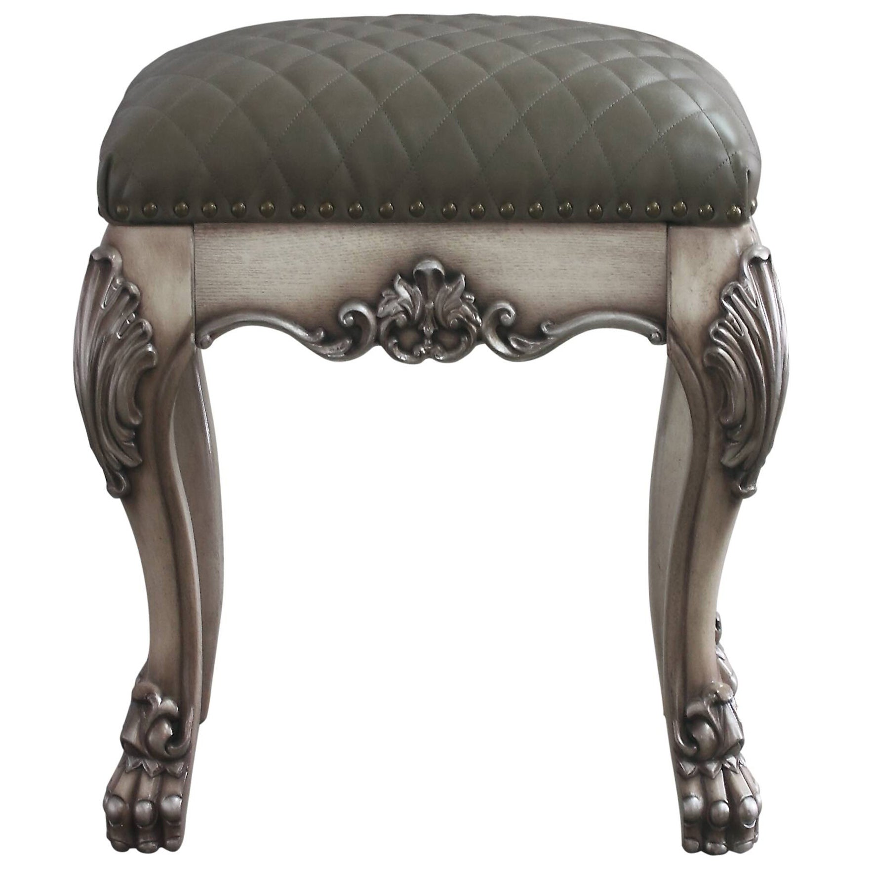 Grey tufted leather vanity stool with carved wooden legs and ornate detailing
