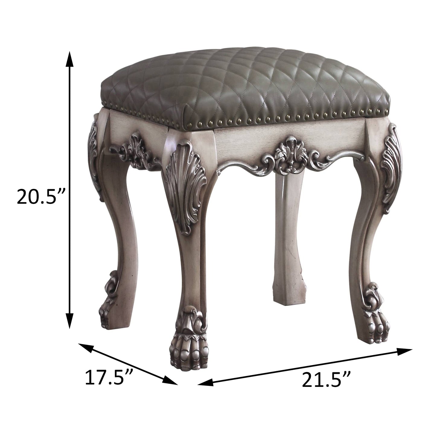 Ornate grey tufted leather vanity stool with carved wooden legs and brass nailhead trim