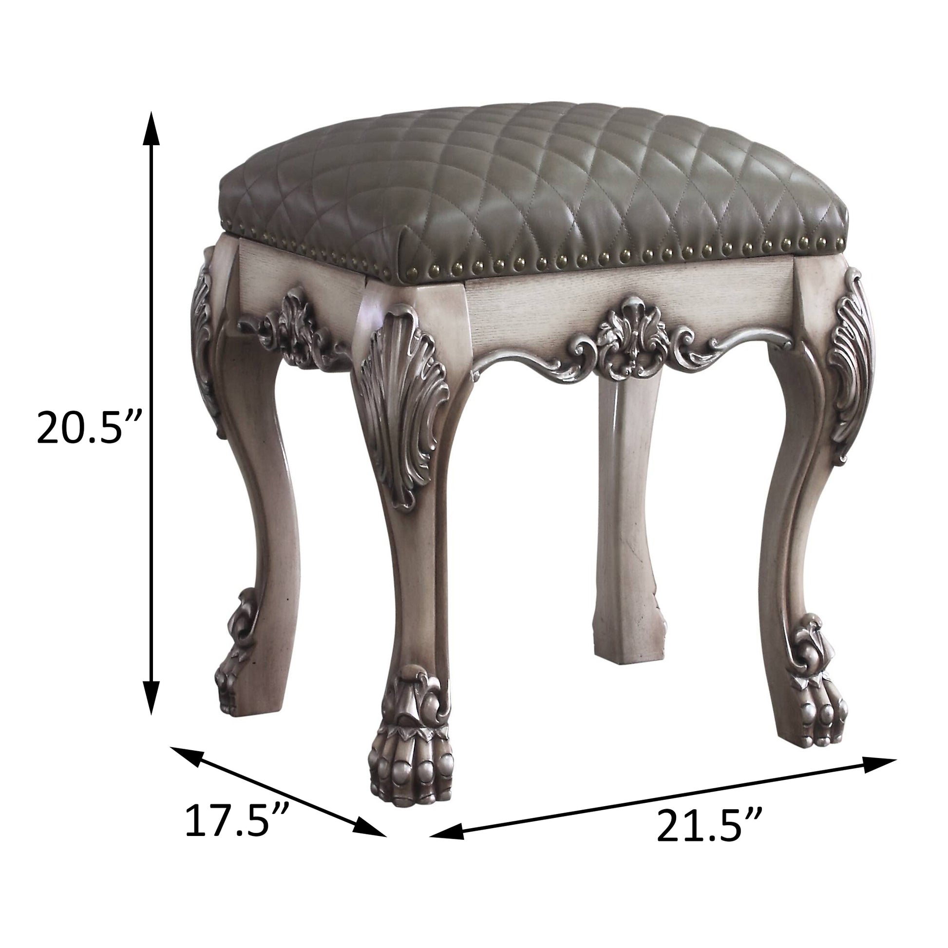 Ornate grey tufted leather vanity stool with carved wooden legs and brass nailhead trim