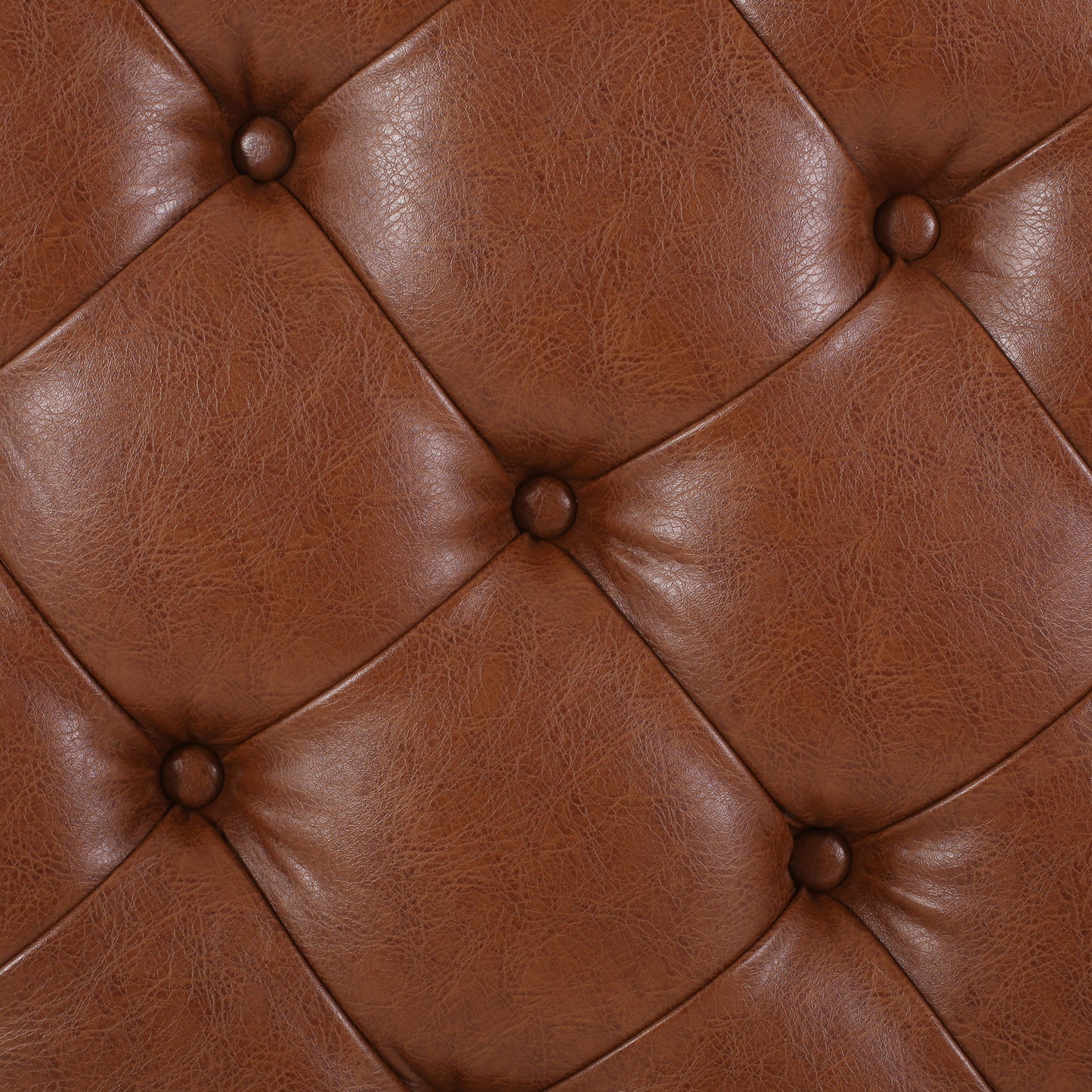 Rich brown tufted leather upholstery with diamond stitching and buttons