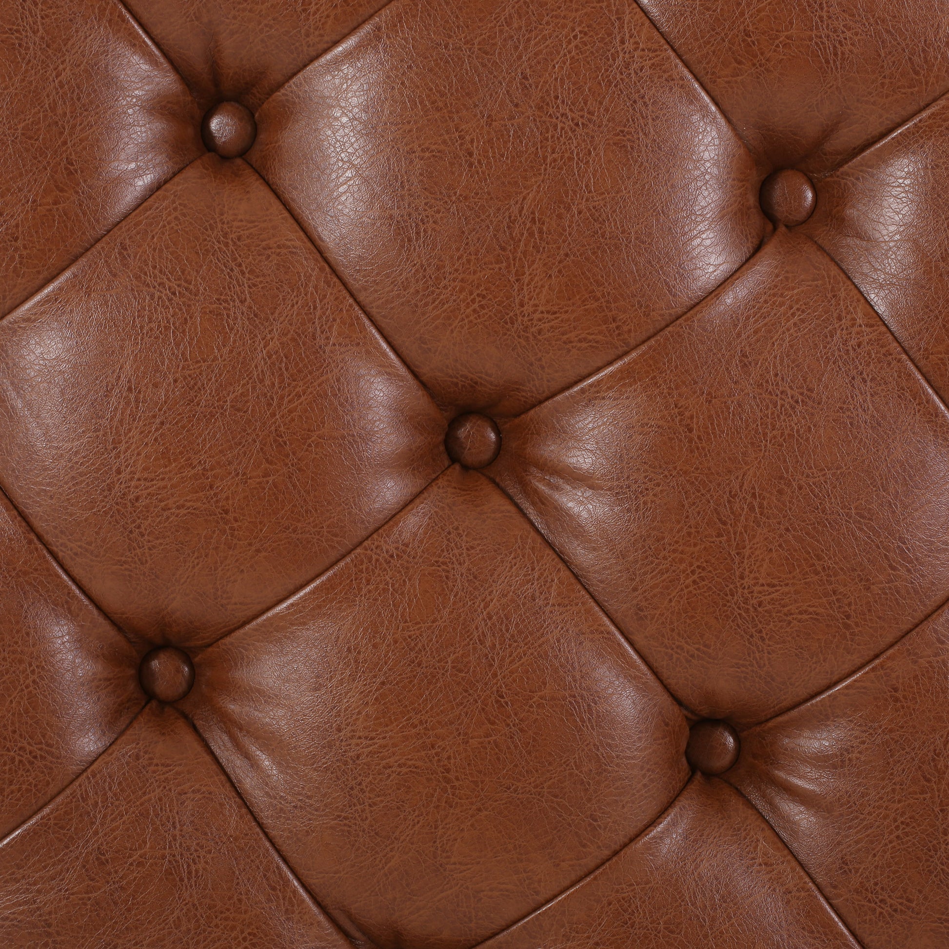 Rich brown tufted leather upholstery with diamond stitching and buttons