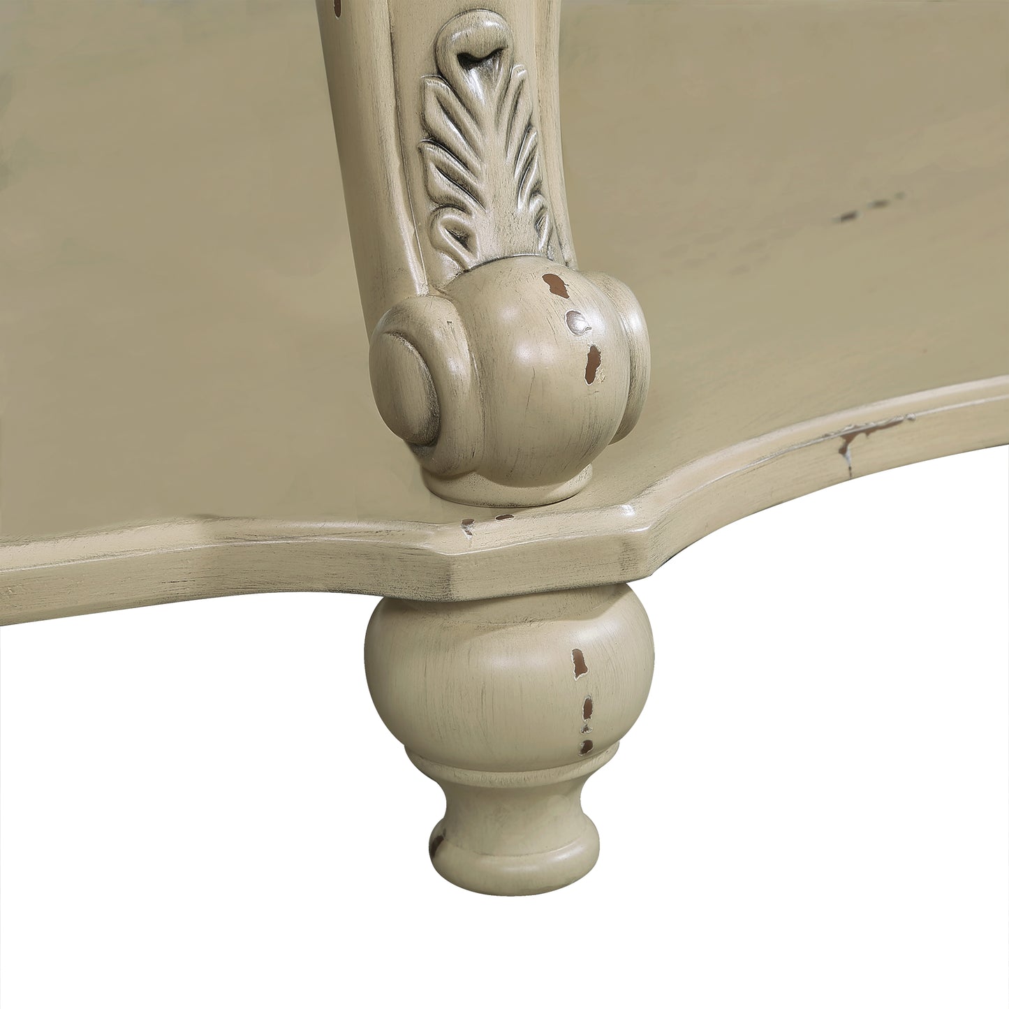 Antique cream carved leg with distressed finish on wooden table