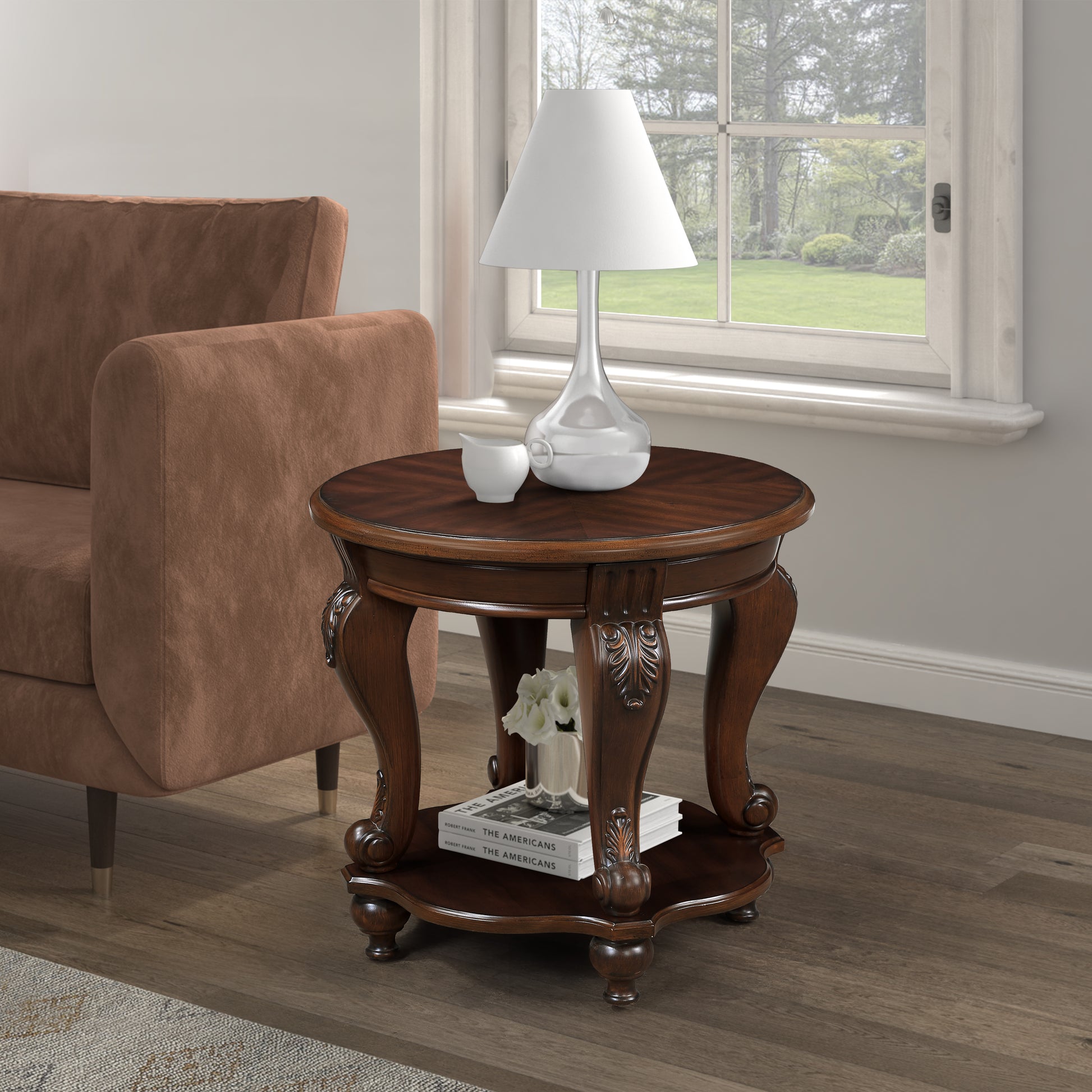 Traditional round end table in dark cherry wood with carved legs and shelf