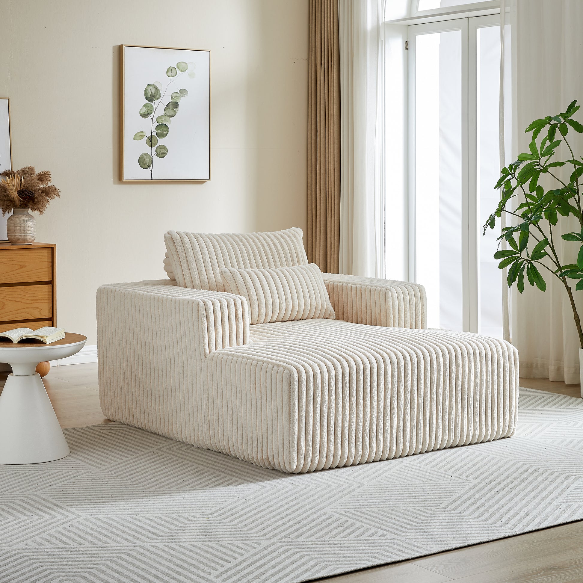 Cream corduroy chaise lounge with plush cushions for ultimate relaxation