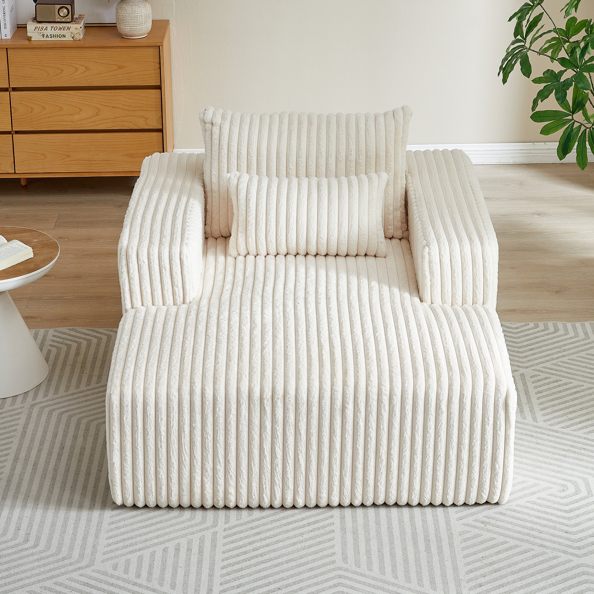 Plush ivory corduroy chaise lounge with lumbar and square pillows