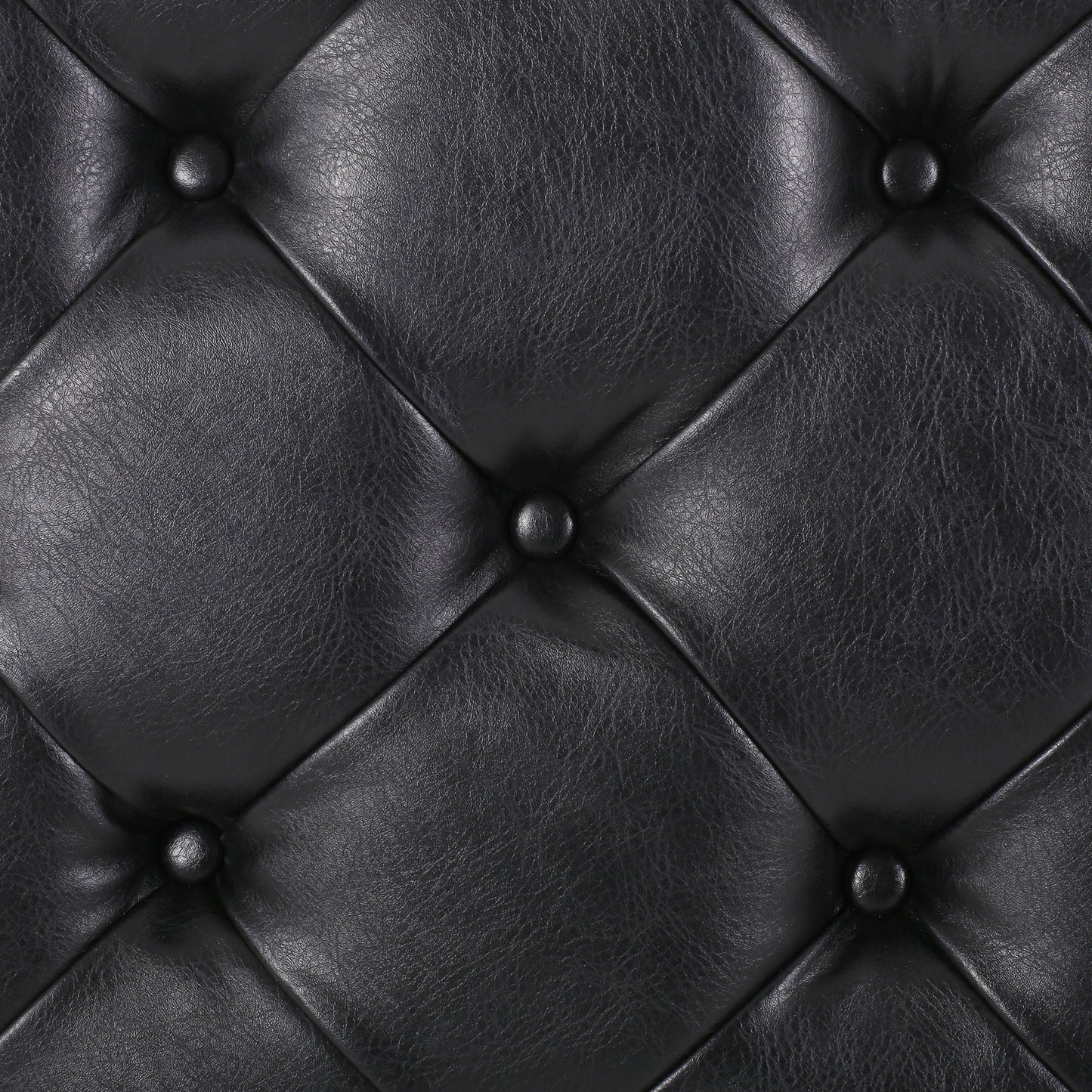Black tufted vegan leather upholstery detail