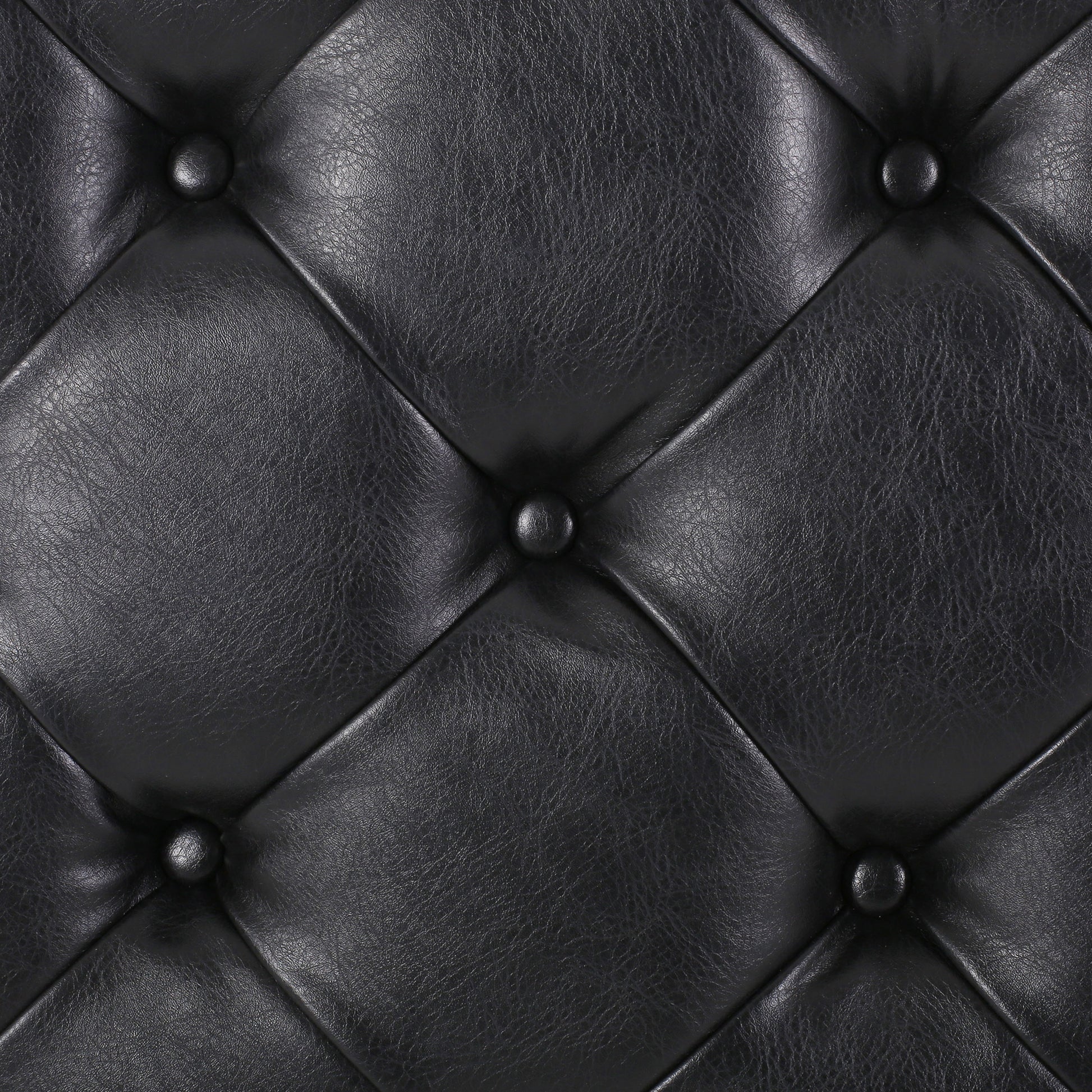 Black tufted vegan leather upholstery detail