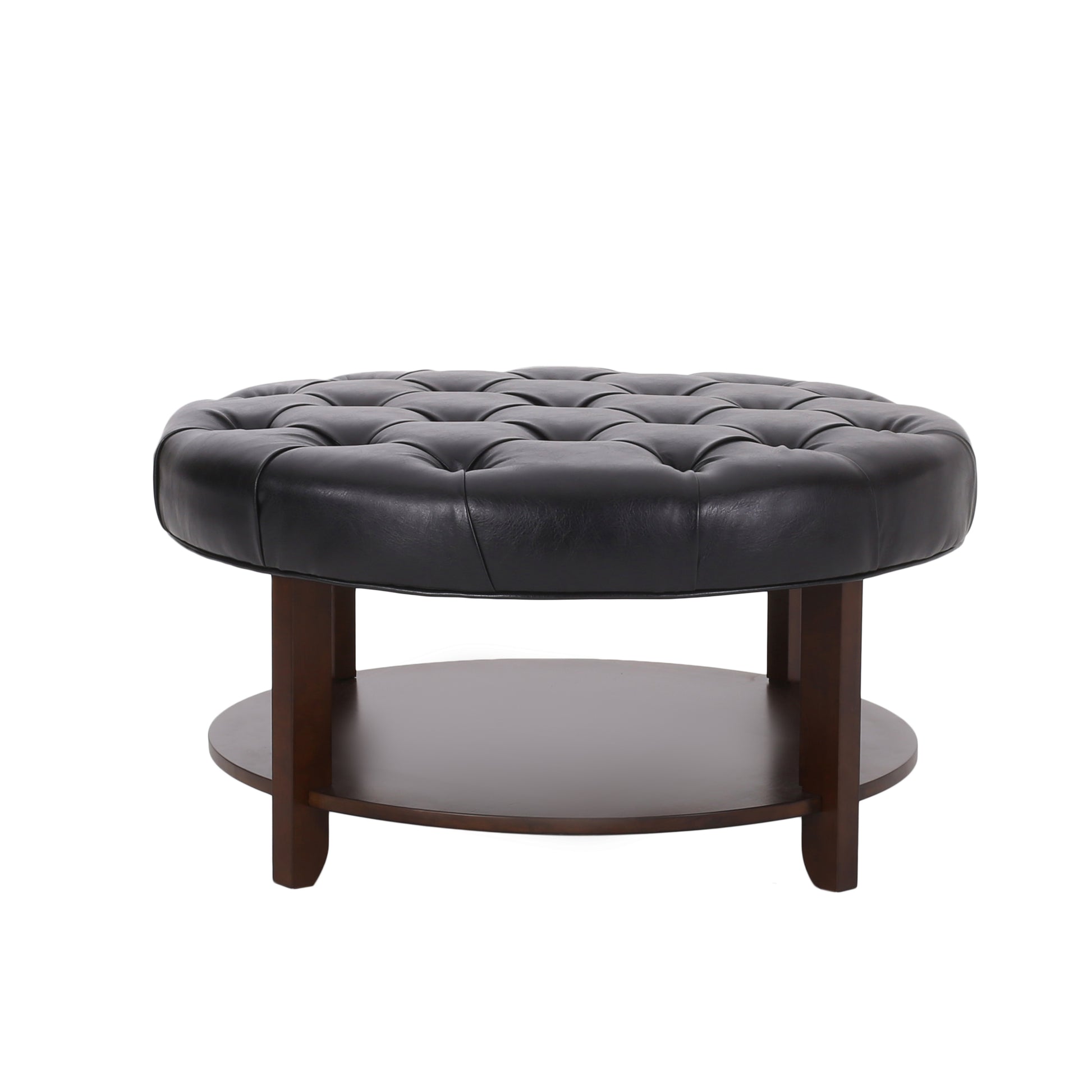 Black leather tufted round ottoman with dark wood base