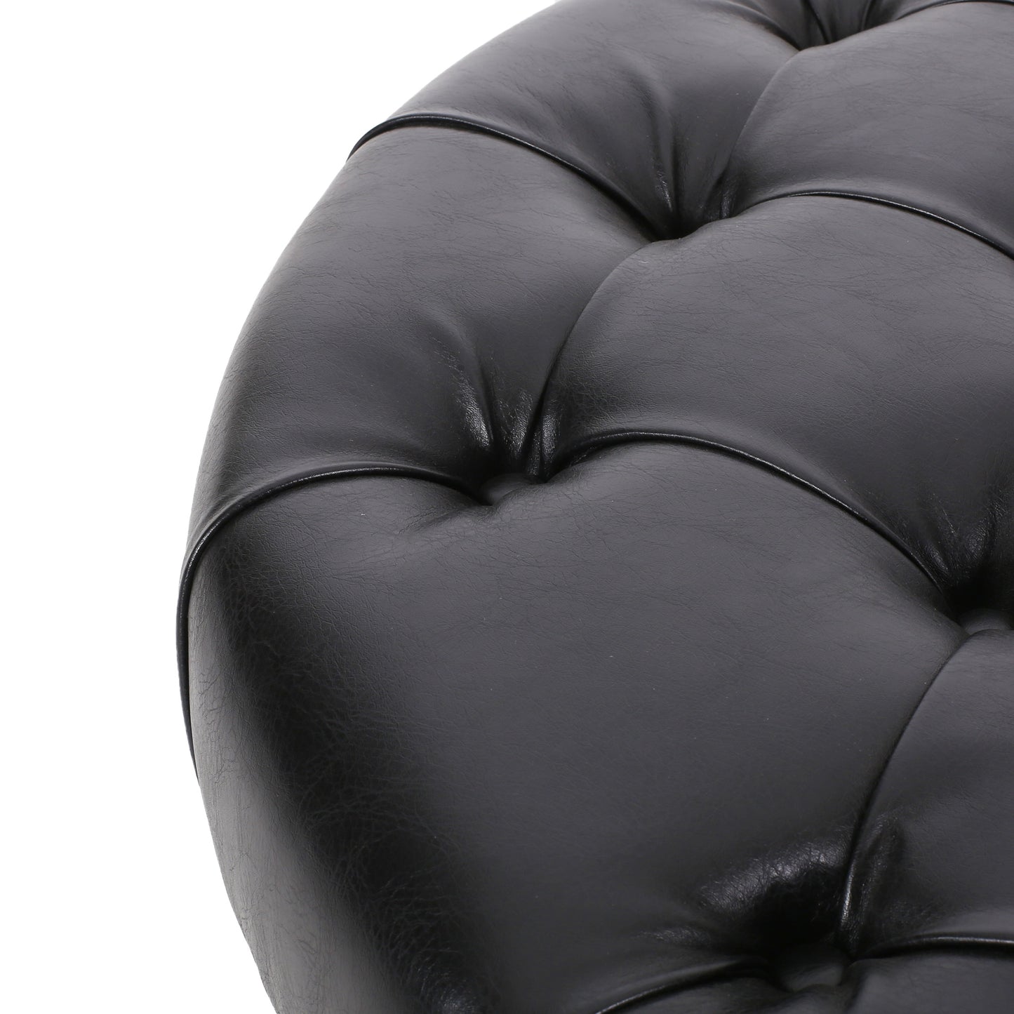 Black leather tufted ottoman detail