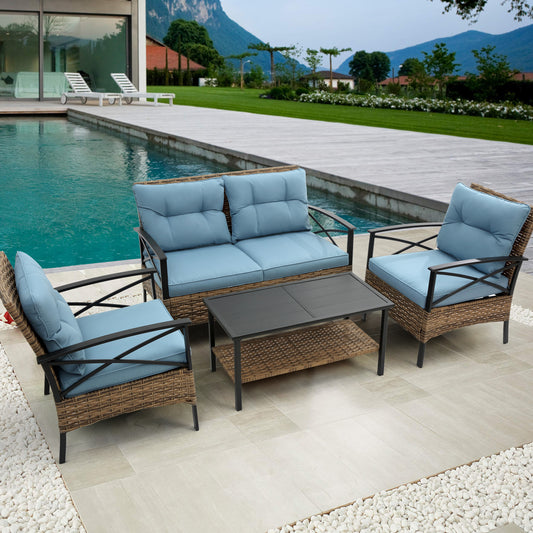 Wicker patio furniture set with blue cushions and dark metal frame