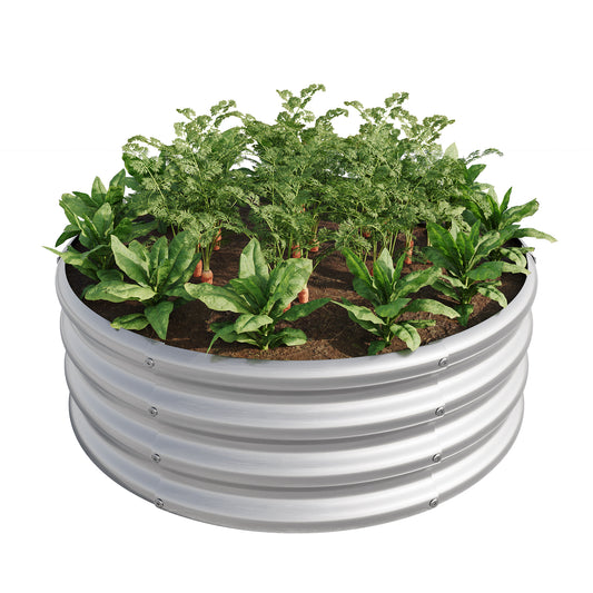 Round corrugated metal raised garden bed with carrots and spinach plants
