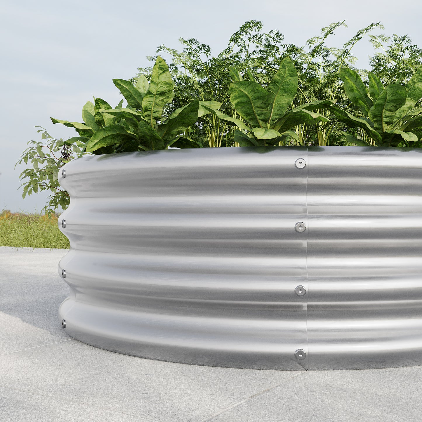 Silver corrugated metal raised garden bed with lush green vegetables growing