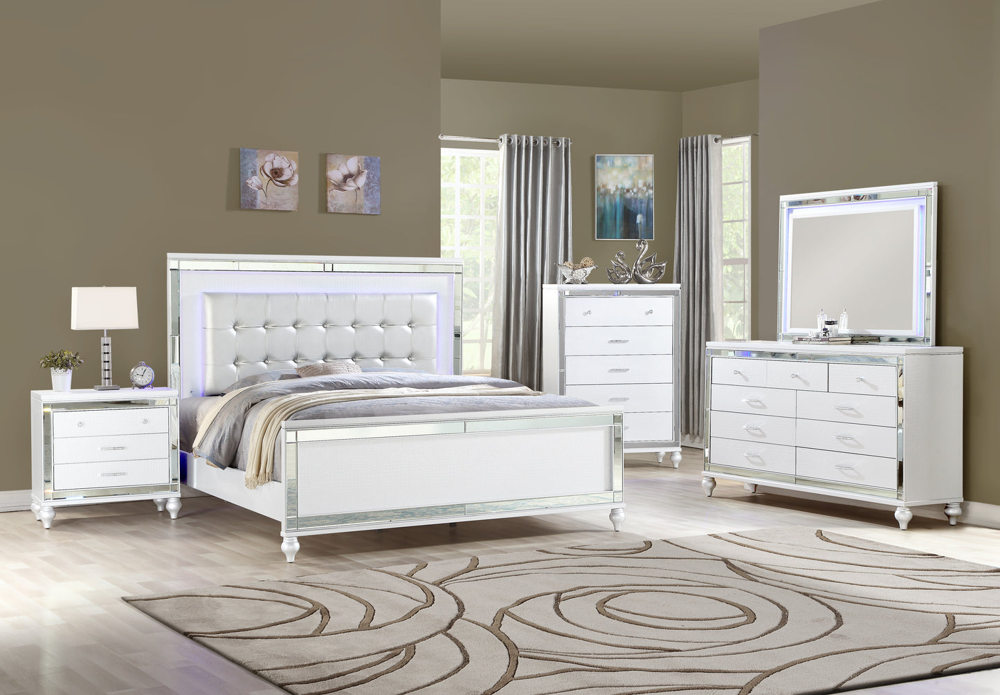White upholstered queen bed with mirrored trim and LED lighting part of a modern bedroom set