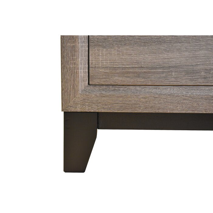 Closeup of distressed oak dresser drawer with dark metal legs