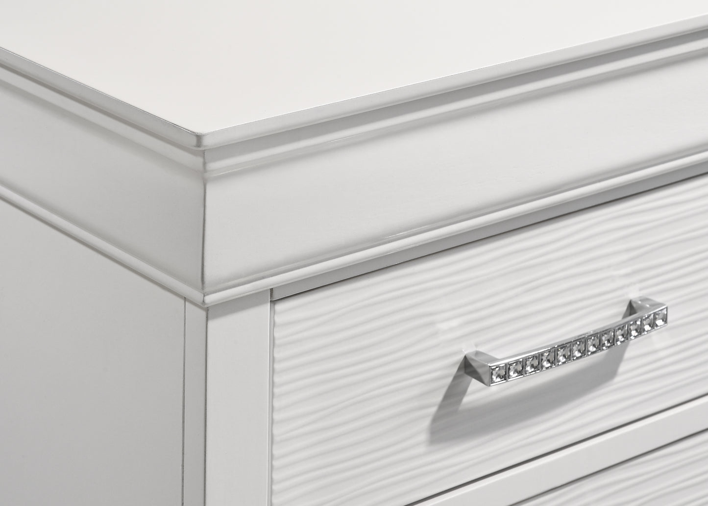 White dresser drawer front with textured surface and crystal knob