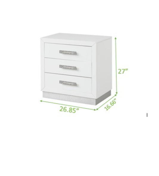 Sleek white threedrawer nightstand with polished silver hardware and modern design