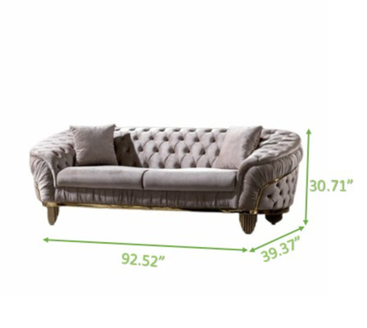 Tufted velvet sofa in light grey with gold trim and wooden legs Elegant living room furniture