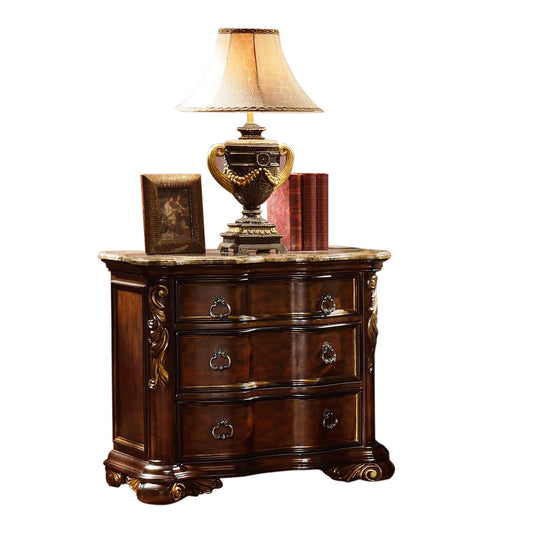Ornate dark wood threedrawer chest with marble top and decorative metal pulls