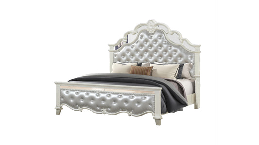 Ornate silver tufted upholstered bed frame with crystal accents and mirrored headboard