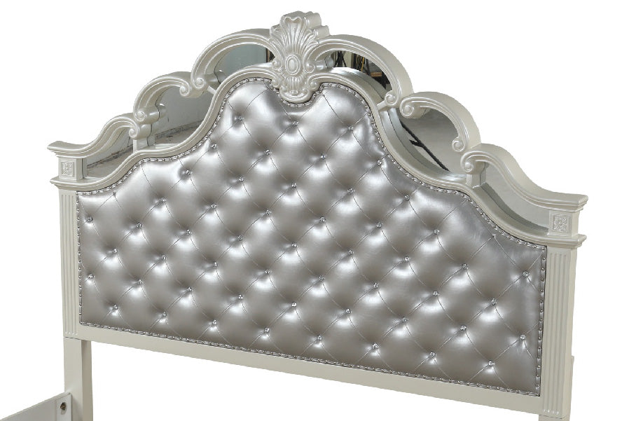 Silver upholstered headboard with crystal tufting and ornate white frame