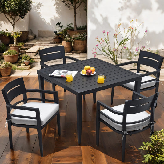 Dark gray aluminum patio dining set with white cushions perfect for outdoor gatherings
